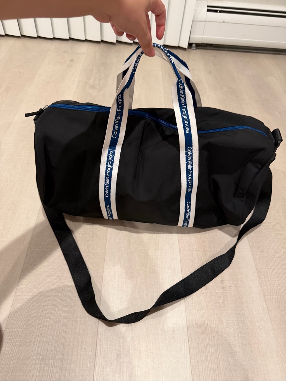 Calvin Klein Black Duffel with White-and-Blue Branded Handles